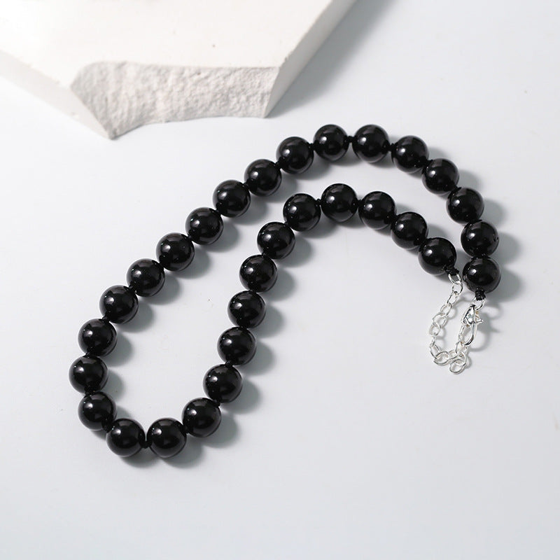 Collier de perles d'onyx noir noué de 12 mm