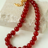 Collana vintage con perline rotonde da 12 mm in onice rosso