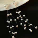 Celestial Dreams Pearl Tassel Earrings