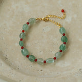 Bracciale con perline di quarzo fragola verde e onice rosso